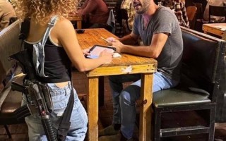 Why do Israelis carry guns with them?
